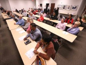 Adam Robison | BUY AT PHOTOS.DJOURNAL.COM Tupelo residents and city officials gather at the Tupelo Police Department for the All-American Conversation, where Mayor Jason Shelton, Police Chief Bart Aguirre and other police department officials answered questions submitted by city residents that attended on Monday night.