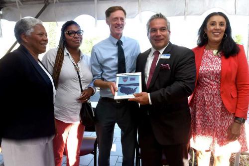 League board member, Anthony Santiago, visits New Haven, CT to present their 2022 AAC Award plaque. 